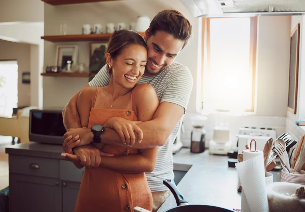 man hugging woman, happy couple