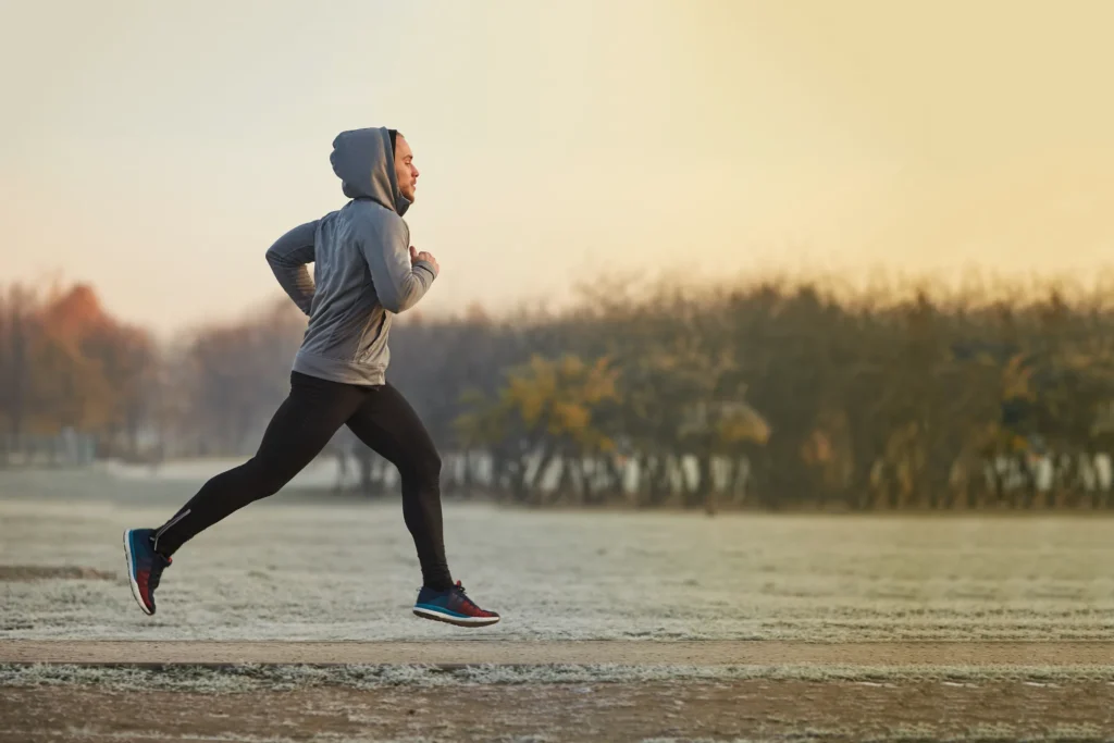 man running outdoors early in the morning