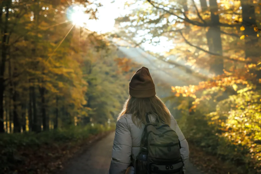 woman on a nature trail staring into the distance