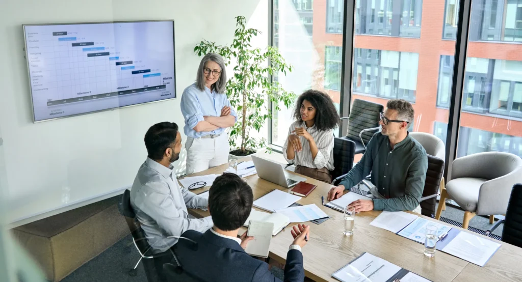 business meeting with papers and laptops on the desk