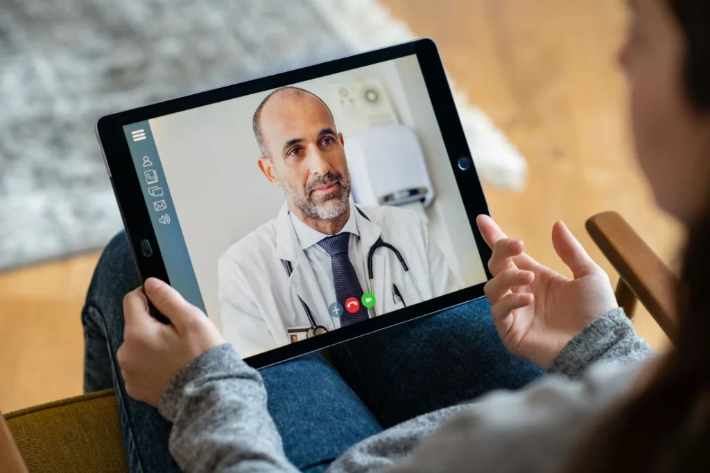 patient in virtual meeting with physician