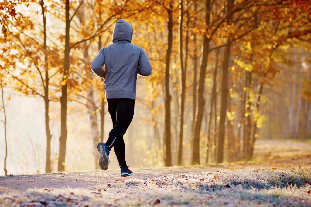 man running on a nature trail