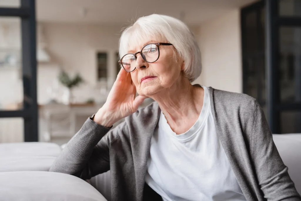 older woman staring into the distance