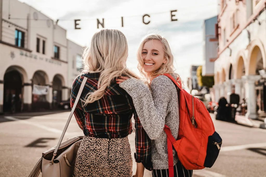 two woman smiling near venice