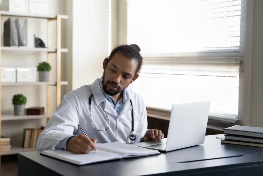 Man writing on desk